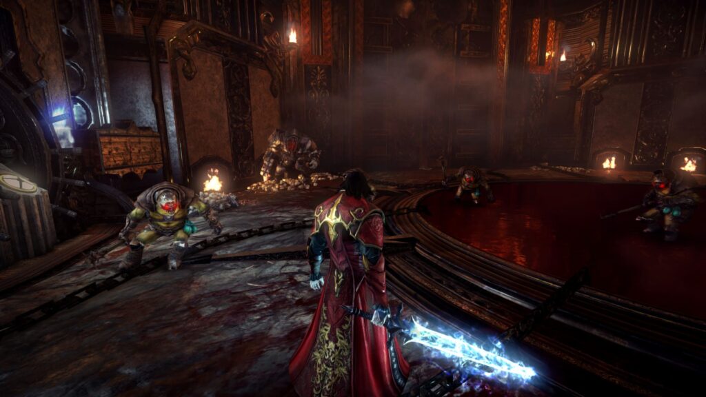 Castlevania : Lords of shadow 2 avec une épée bleue et des ennemis robotiques sur une plateforme
