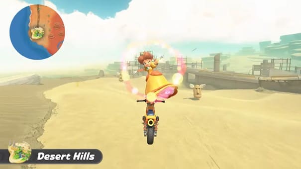 Héritière dans sa robe avec sa couronne sur une moto dans le désert dans Mario Kart 8